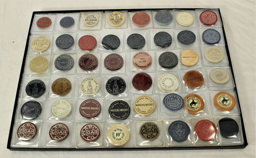 Group of Saloon Chips and Tokens: A very large grouping of casino chips and various tokens for free whiskey, cigars or beer, with great markings from Granby CO, Cheyenne Frontier Days, and other places. Category: Gambling