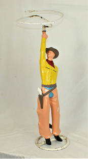 Cowboy Water Sprinkler: Sought after yard watering sprinkler in the motif of a tall cowboy twirling a rope. Measuring 36" x 12". Category: Miscellanious