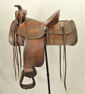 Western Saddle Mfg. Co Saddle: Nicely presenting 1940's style Denver made saddle with wide basketstamped pattern, high cantle, and 15" seat. With very nice condition and makers marks. Category: Saddle