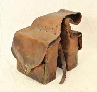 Medicine Saddle Bags: Interesting early saddlebags made with compartments to hold medicinal pharmacy bottles. Showing nice condition and makers mark. Category: Saddle