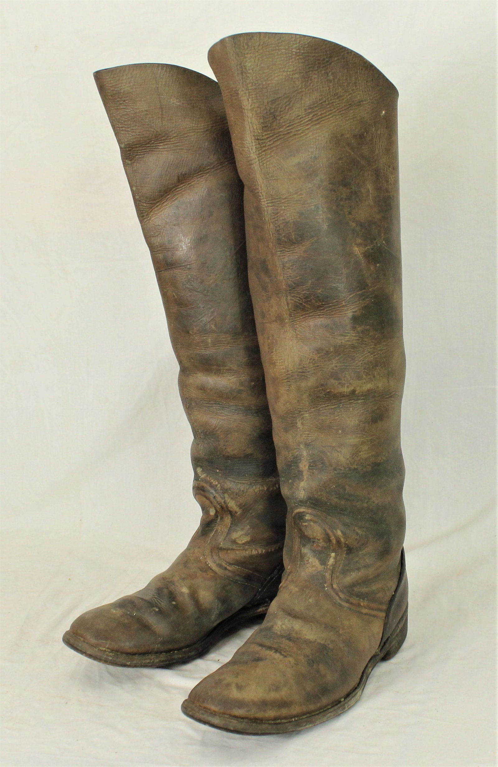 Tall 1860's Boots: Unusual extra tall pair of frontier or miner's boots with a pleasing color and condition, standing 22" tall. Category: Boots