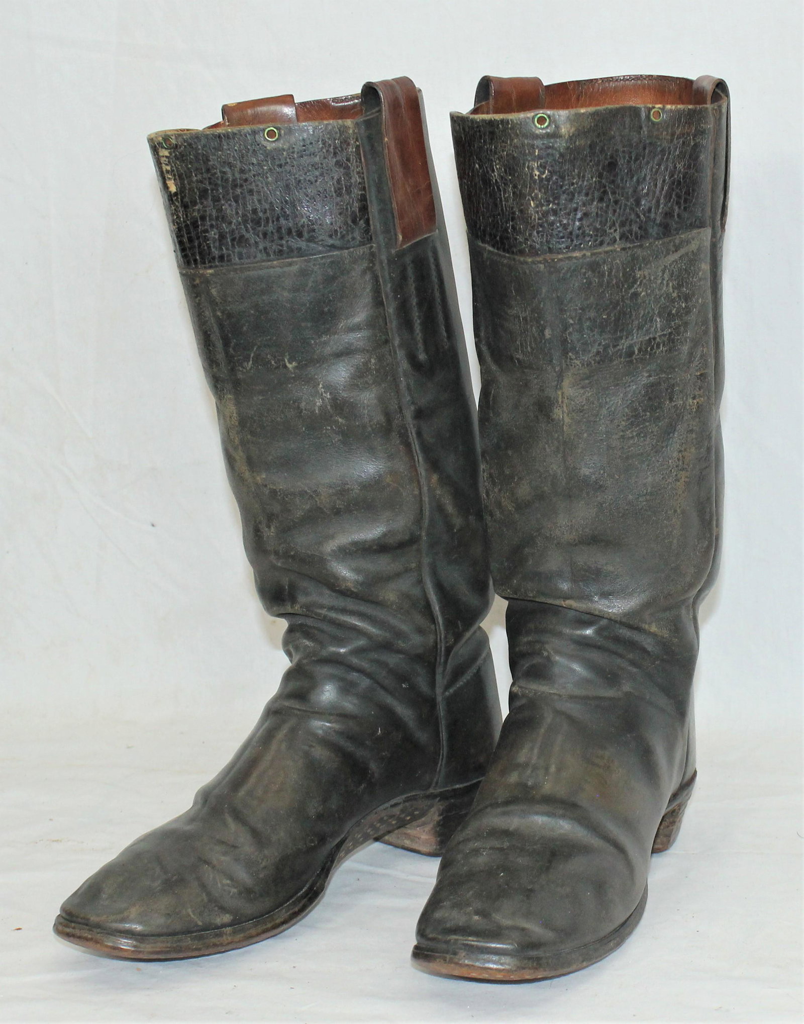 Tall Stovepipe Cowboy Boots: Early turn of the century stovepipe cowboy boots with leather pulls marked "101", two-piece tops and square toes. Category: Boots