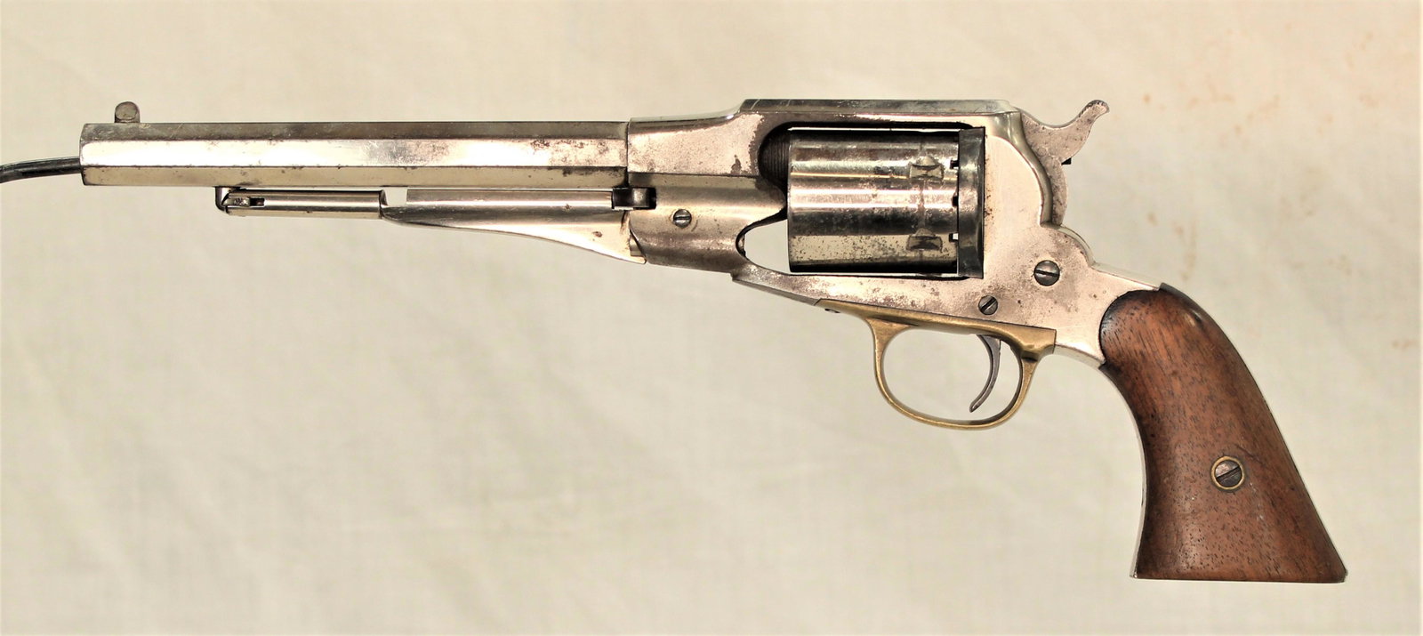 Remington Conversion Revolver: Classic Remington Model 1858 conversion revolver. Chambered for 46 rimfire cartridges, with nearly 90% of its period nickel finish. These Conversion revolvers were utilized more than the later Colt Si