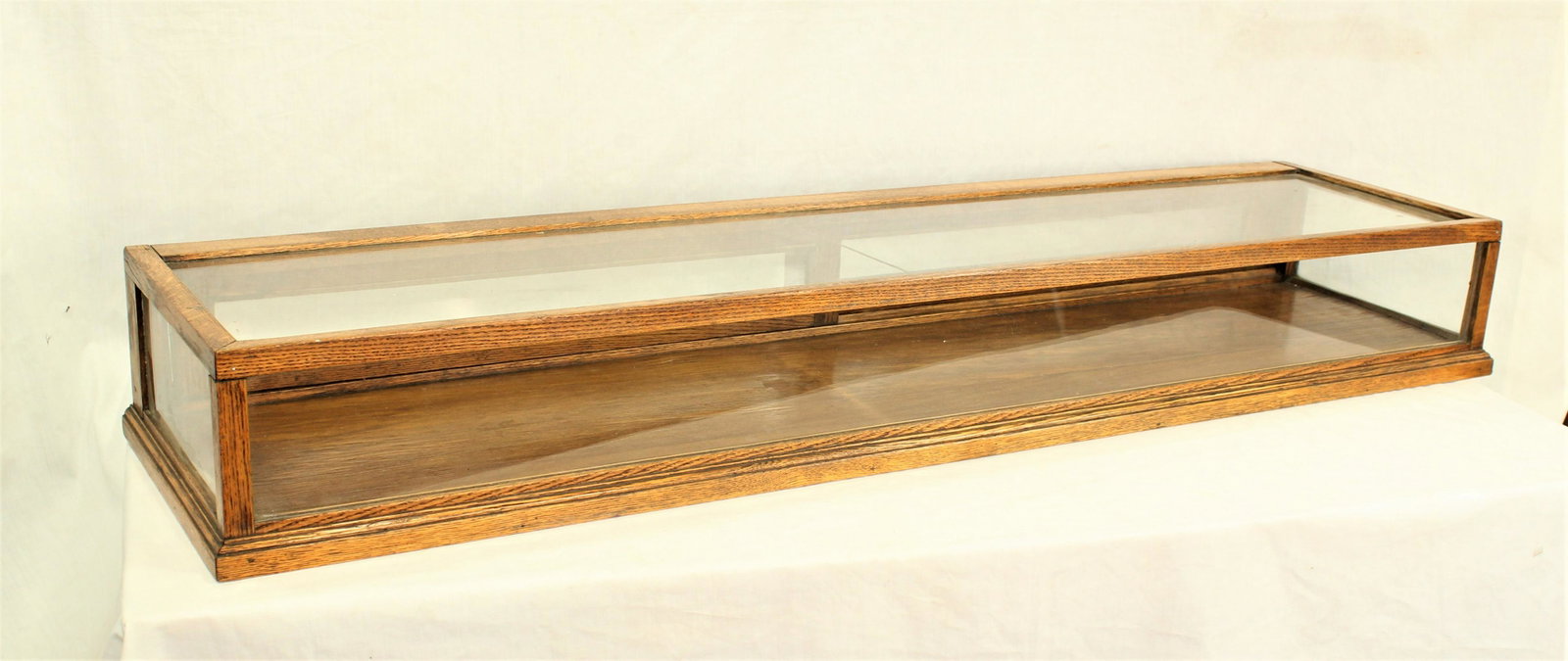 Antique Display Case: Very pleasing, hard to find oak countertop display case with sliding mirror back doors. Measuring 48"x 12"x 6". Perfect for pistols or spurs.