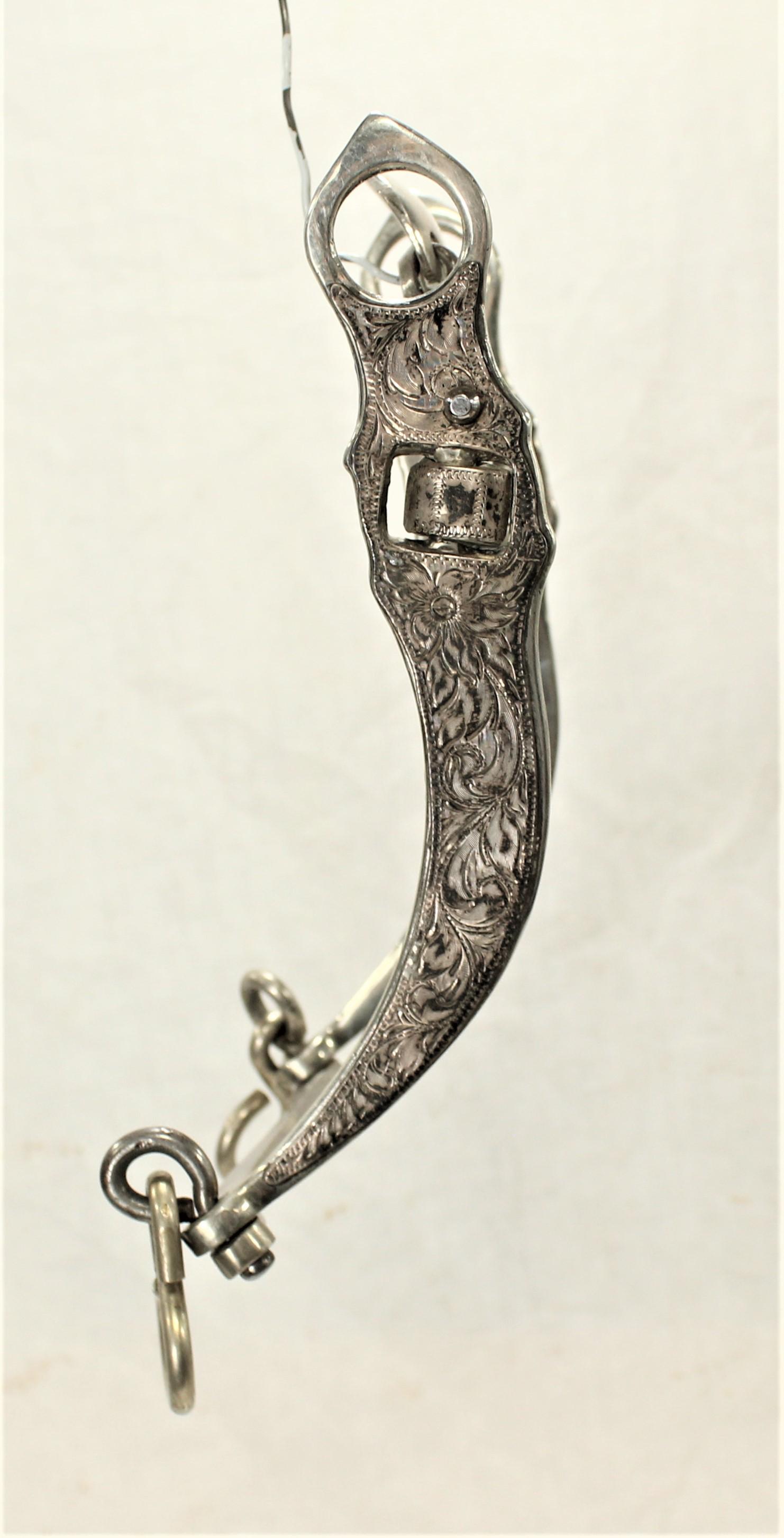 California Spade Bit: Interesting fully silver mounted banana cheek bit with spade mouthpiece. Has unclear mark on back of lip bar.