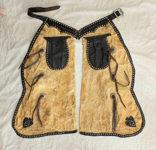 Batwing Chaps: A interesting pair of vintage two tone chaps most likely made as movie or show apparel. Great display chaps, showing wear and age.