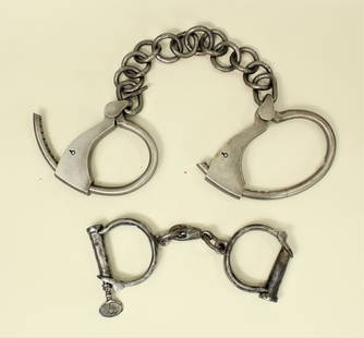 Grouping of Frontier Handcuffs: Two pairs of heavy steel handcuffs, complete with their keys.