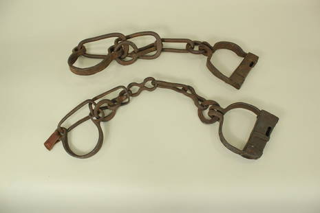 Grouping of Early Leg Irons: Two pairs of hand made wrought iron leg shackles with heavy chain.