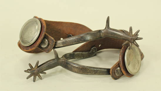 Northern Plains Spurs: A stylish pair of early forged iron spurs with stylish lady leg shanks and very nice straps.