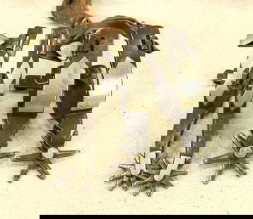 Grouping of Kelly Bro's Spurs: Two pairs of Kelly Bro's spurs, one pair of single mounted Chihuha pattern, and one pair of single mounted Bowties, both showing nice condition, and patina.