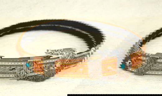 Navajo Horsehair Belt: A nearly unused belt or hatband, measuring 31", with a nice mixture of hitched horsehair, with leather ends and accented by a nicely crafted buckle set.