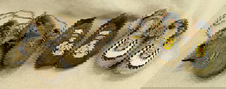 Grouping of Moccasins: A lot of three pair of early 20th Century Northern Plains moccasins with beaded designwork. All in adult sizes, with heavy wear.