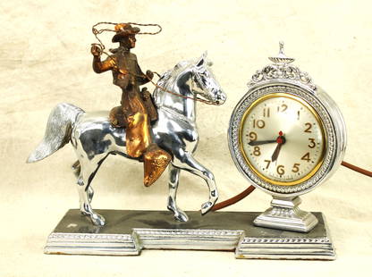 Antique Horse Clock: A classy looking mantle clock, maker marked by Sessions, with a great cowboy motif, in a faux copper and nickel finish, and attractive clock face. Measuring 13"x 11".