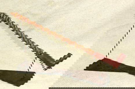 Plains Indian Pipe: A well done Native American pipe, with 20" long spiraling wood stem, and deep red catlinite bowl.