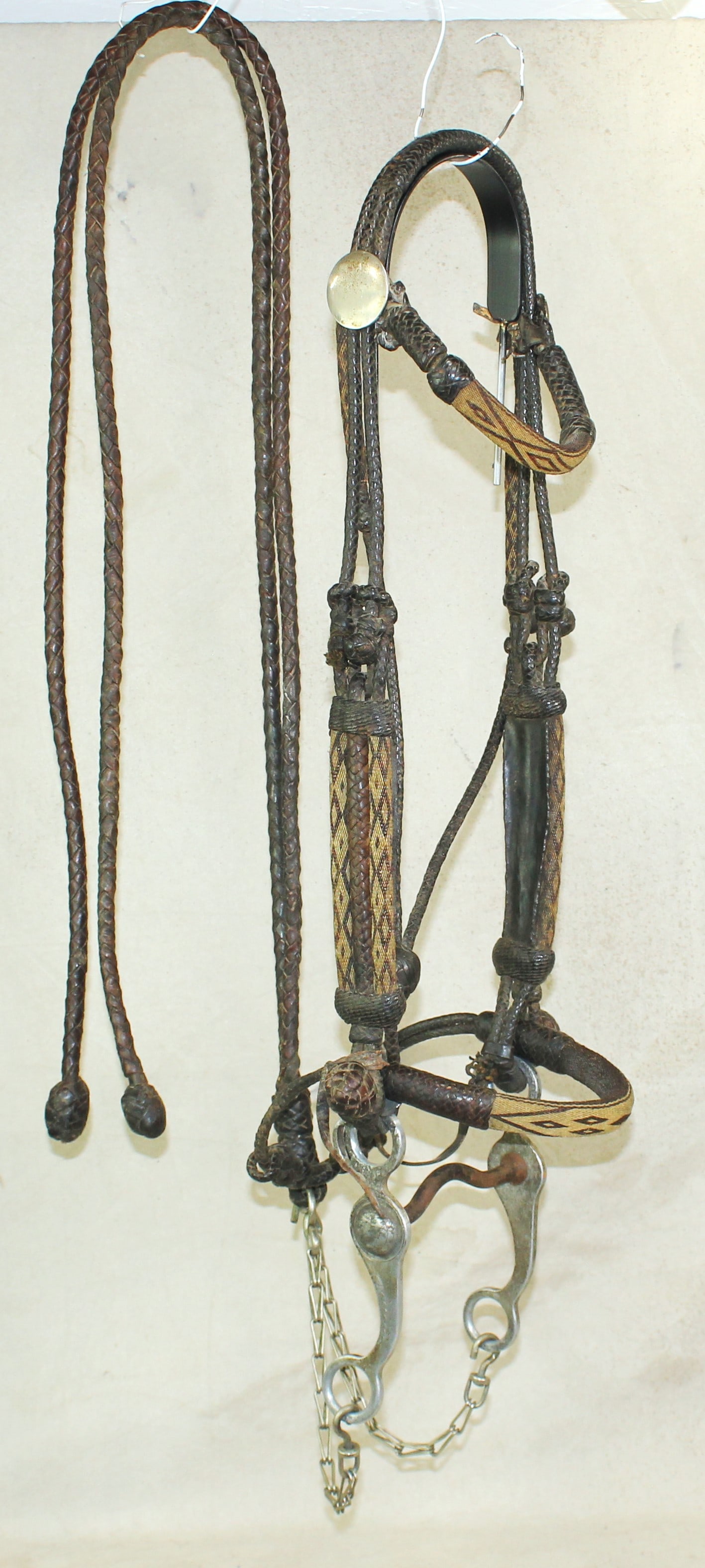 Wyoming Horsehair Bridle: An early and unique bridle with a great combination of black and white hitched horsehair and braided leather. A massive bridle with rarely seen triple-banded cheekpieces, browband and noseband. Displa