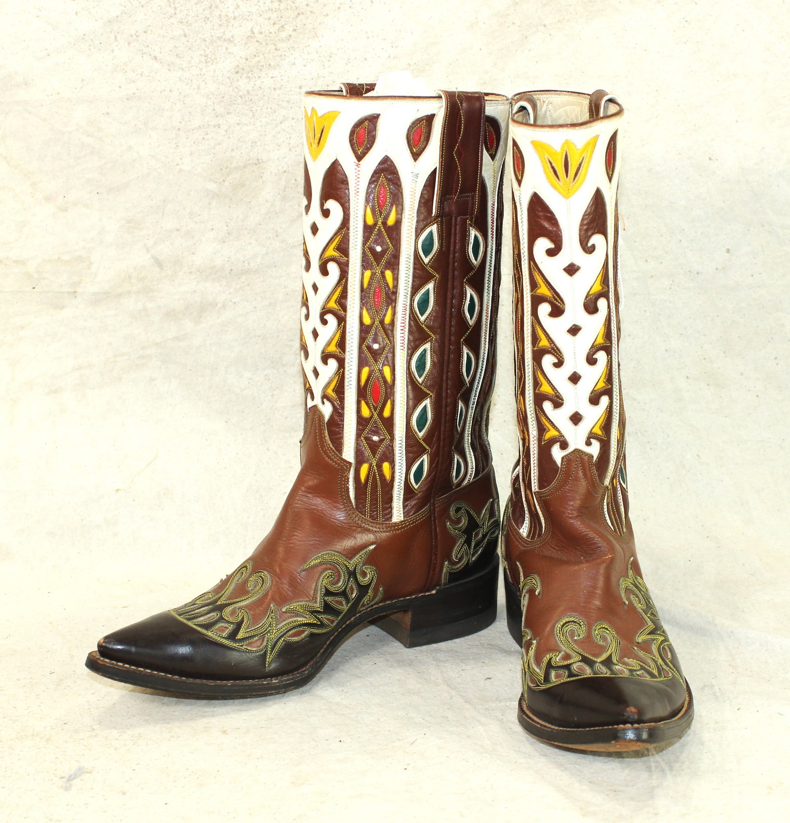 Stovepipe Cowboy Boots: A bright colored pair of 1950's style cowboy boots, marked Don Quijote, with finely detailed cut-outs and colorful inlays, with stylish pointed wingtip toes, walking heels, and 13" stovepipe tops. In 