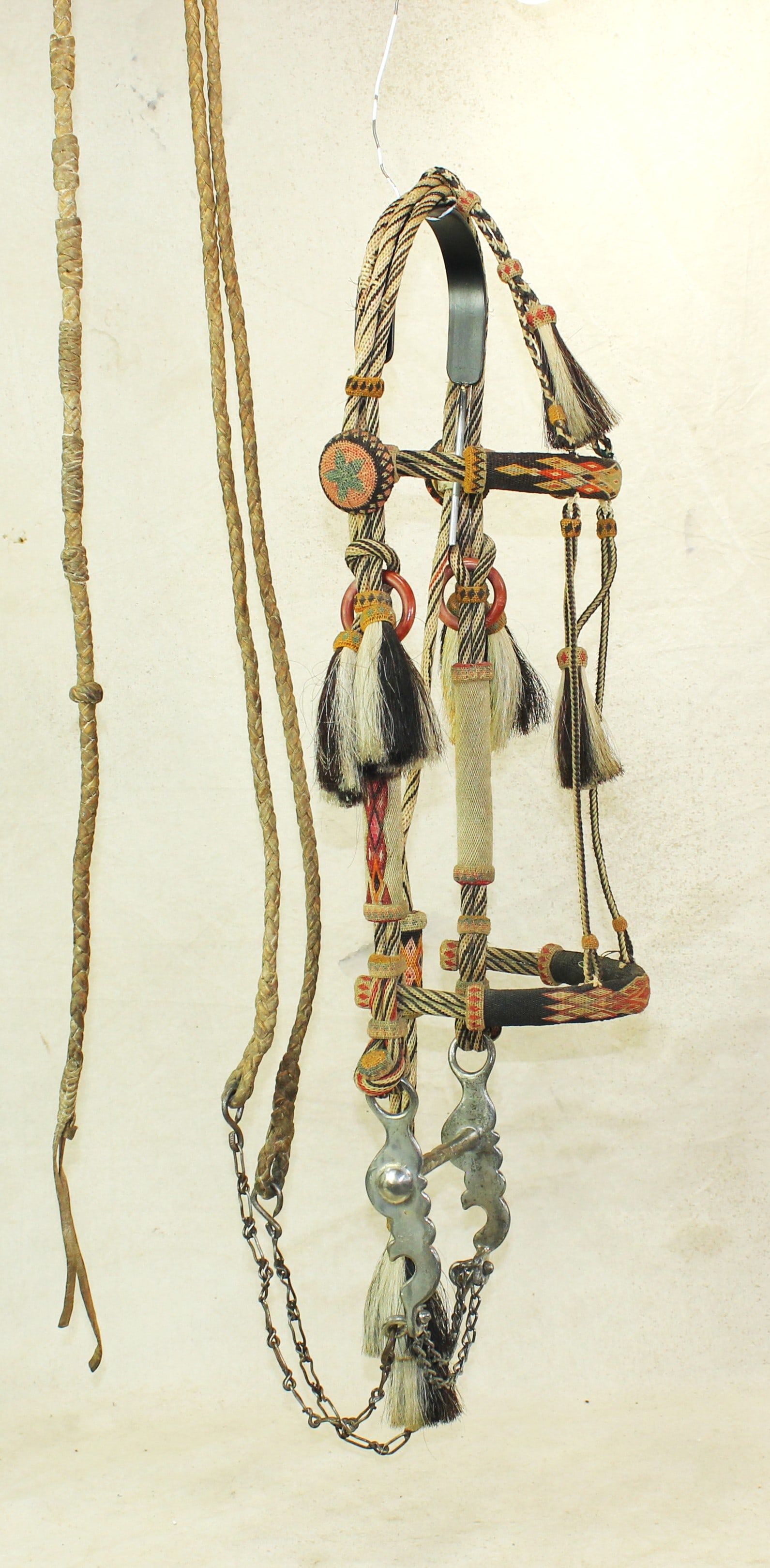 Yuma Prison Horsehair Bridle: This is an eye dazzling hitched horsehair bridle made in the Arizona Penitentiary, displaying beautiful authentic cowboy style, with great colors, fully hitched huge dome rostettes, several large tuft