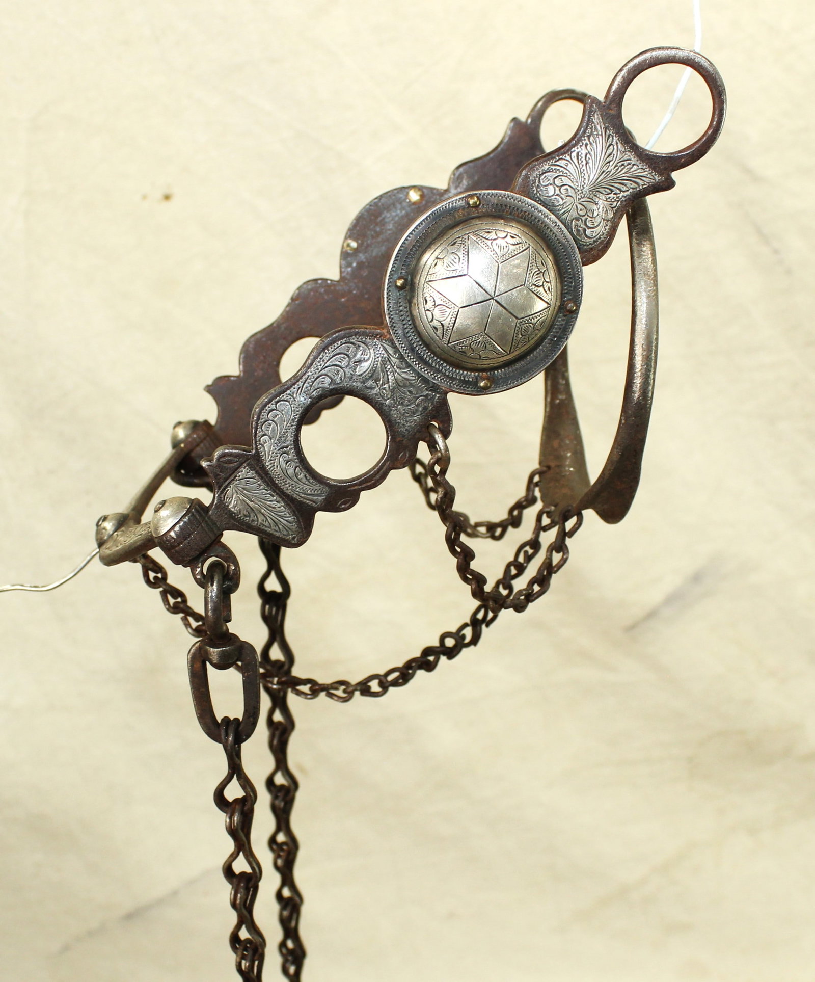 Outstanding Silver Ring Bit: An incredibly fine early silver mounted California ring bit, in an early style of Larios, with intricate engraving, and great detail and condition.