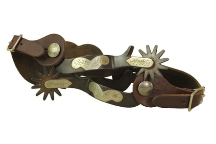 Single mounted pair of Crockett mustache pattern spurs with chap guards and large rowels.