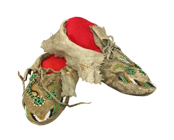 Interesting pair of Apache moccasins with supple leather, showing great age and appealing beadwork.