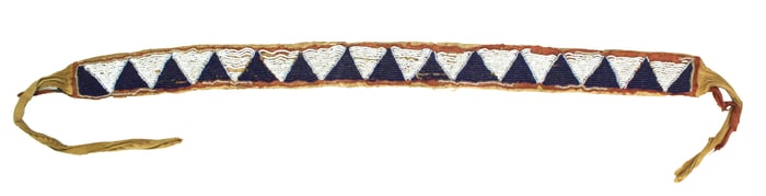 A stylish Native American beaded belt with appealing geometric design on cloth with cloth tie ends,