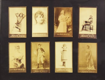 Framed collection of tobacco cards with early "erotic women" in various poses.