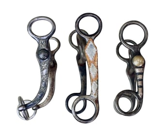Three attractive short shank grazing bits; 1) A beautiful silver inlaid Buerman with early Star AB