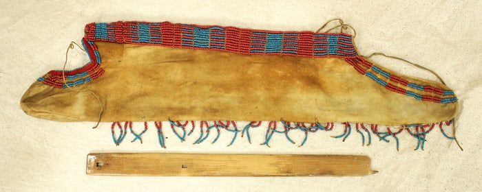 A 19th century Blackfoot Indian buffalo hide quiver, trimmed in pony style glass beads, showing