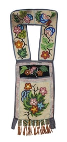 Large beaded Native American bag adorned with intricate beadwork and floral motif.