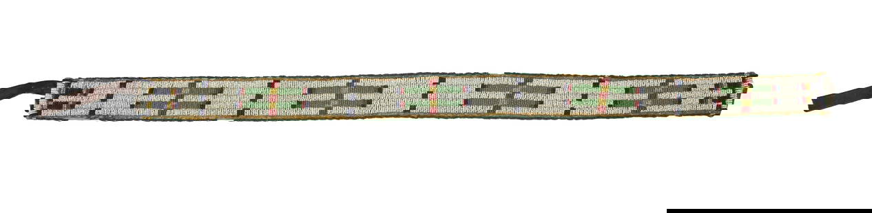 Extra fine Sioux Indian beaded childs belt. Decorated with early tiny seed beads in a unique: Extra fine Sioux Indian beaded childs belt. Decorated with early tiny seed beads in a unique pattern. Measuring 25" in length.