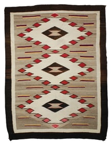 Eye catching Native American rug with serrated diamonds and uncommon magenta color. Measuring 33"x