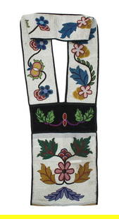Beaded Bandelier Bag: A large heavily beaded bag and strap with eye dazzling floral pattern of brightly colored beads.