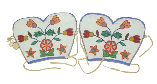 Great pair of large Northern Plains polychrome beaded cuffs with floral design, likely from the