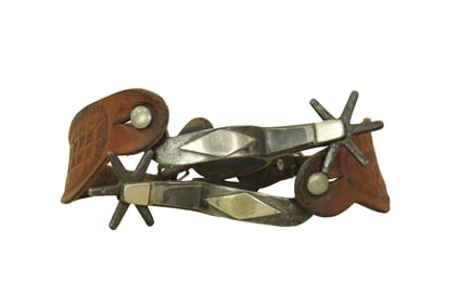 Large pair of double mounted spurs with double diamond pattern and large 5-point rowels, and
