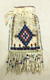 Nicely done 19th Century Native American intricately glass beaded bag with decorative fringe.
