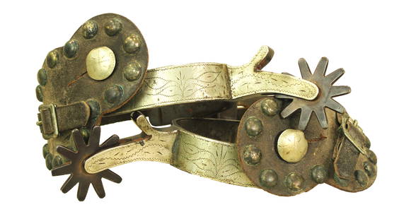 Crockett Booger Red Spurs: Sought after inside marked Booger Red pattern spurs, single mounted with detail engraved full silver overlay, and period straps.