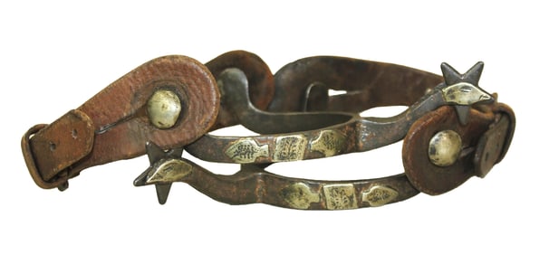 Single mounted pair of McChesney's with goosehead tipped shanks and original straps.