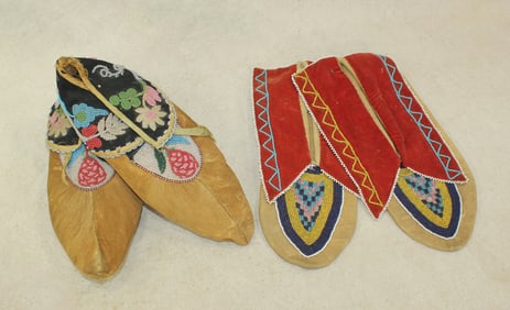 Grouping of two pair of Native American moccasins with large cuffs, and attractive beadwork. In