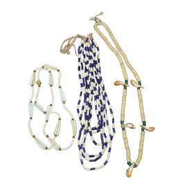 Three Native American necklaces of strung shells and trade beads.
