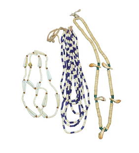 Three Native American necklaces of strung shells and trade beads.: Three Native American necklaces of strung shells and trade beads.