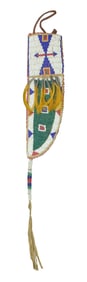 An extra nice Northern Plains knife sheath, fully beaded with a pleasing design, and accented by a