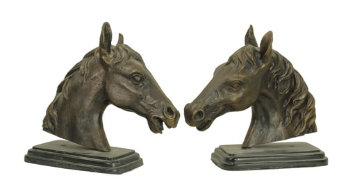 An attractive pair of figural horsehead motif book ends with nice profile. Dimensions 11"x 12".