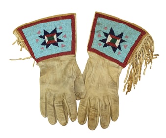 Circa 1890's leather gauntlets with fully beaded cuffs having a pleasing blue background and