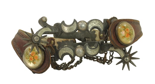 An early pair of single mounted California style spurs with finely detail engraved silver, drop