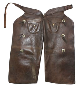 Large pair of batwing chaps with desirable russet color, tooled belt and nickel conchos. Measuring