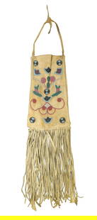 Cree Beaded Bag: Finely beaded buckskin bag with interesting seed bead design, with great color and long fringe. Measuring 17" in length.