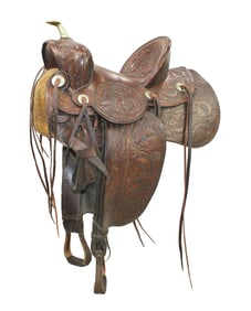 This terrific 1920's period saddle is in near mint condition and shows an uncommon large scalloped