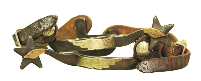 Popular pair of single mounted flying geese spurs with brass and silver mountings and completed by