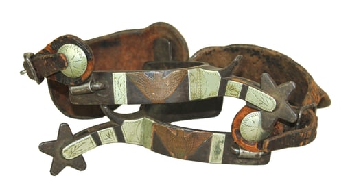 Great looking pair of single mounted eagle motif spurs with copper and silver mountings, topped off