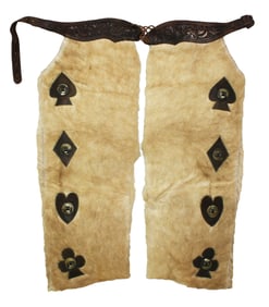 An unusual pair of hair-on cowhide chaps with decoratively applied card suit pattern centered with